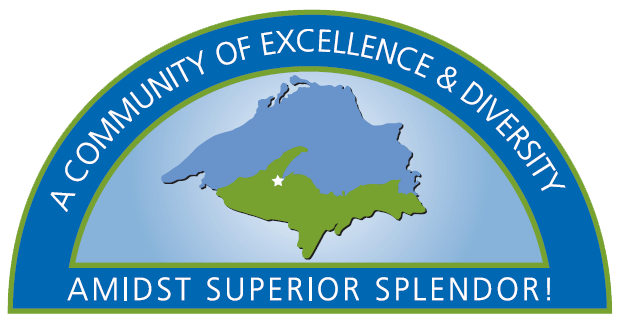 Top of logo showing location of village on the U. P. and their slogan, a community of excellence & diversity amidst superior splendor.
