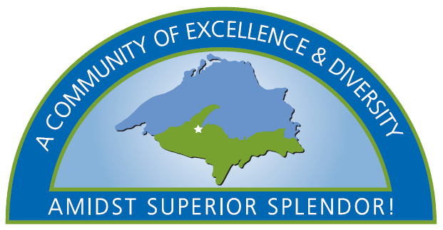 Top of logo showing location of village on the U. P. and their slogan, a community of excellence & diversity amidst superior splendor.
