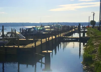 View of boats docked at floating dock on a sunny day and showing ramps from pier on Keweenaw Bay on Lake Superior