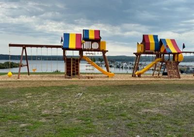 Playground equipment at Capul Park with Lake Superior in the background